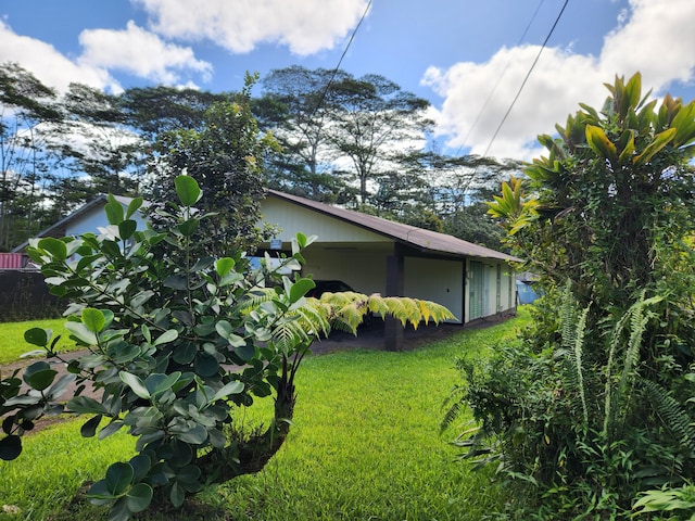 view of home's exterior featuring a yard