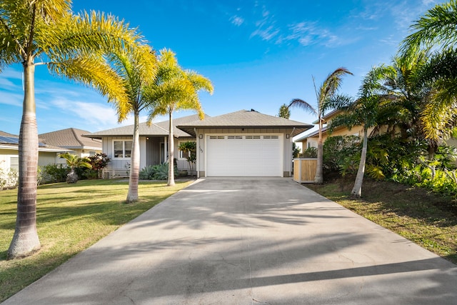 view of front facade featuring a garage and a front yard