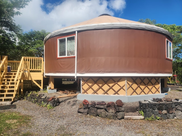 view of property exterior featuring a deck