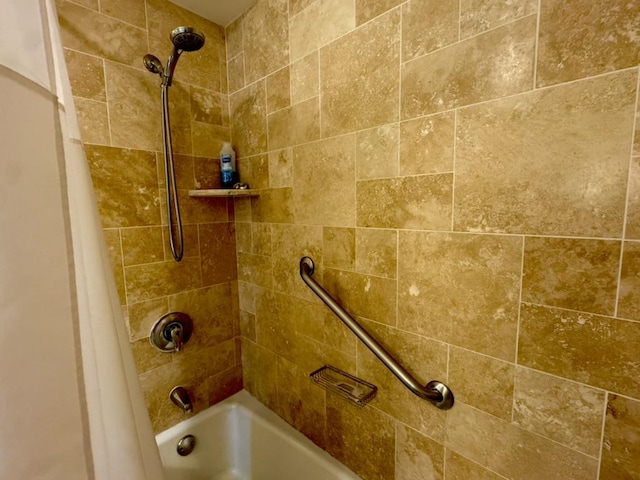 interior details featuring shower / bath combo with shower curtain