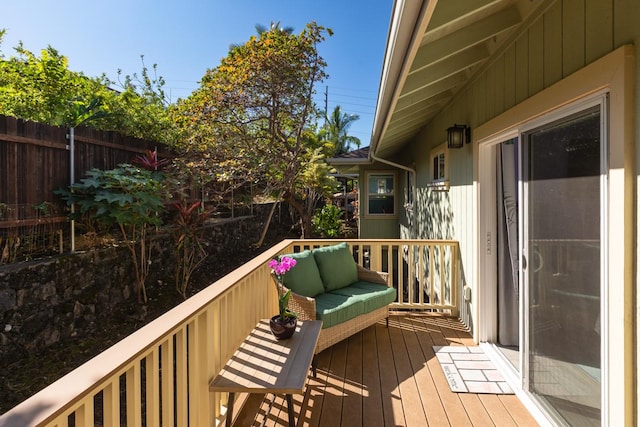 wooden terrace featuring fence