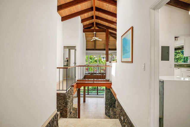 hallway featuring beam ceiling, high vaulted ceiling, a wealth of natural light, and wooden ceiling