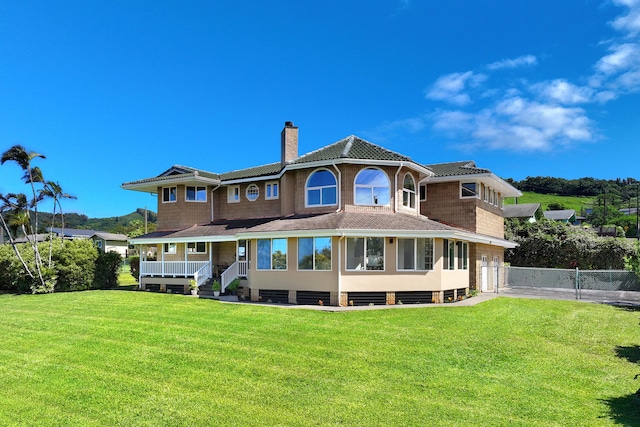 back of house featuring a yard