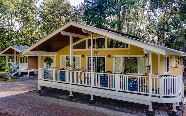 view of front of house featuring a porch and metal roof