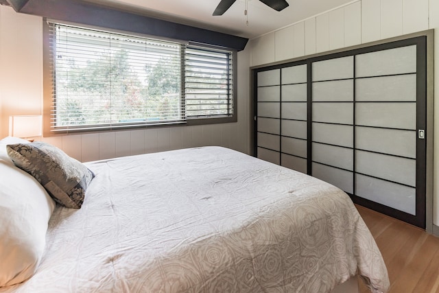 bedroom with ceiling fan and wood finished floors