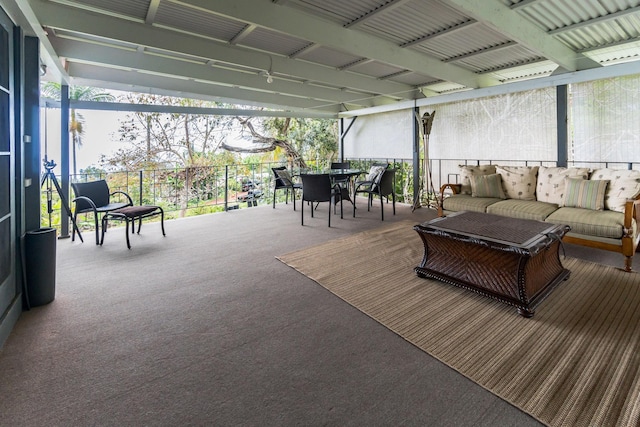 sunroom / solarium with a water view