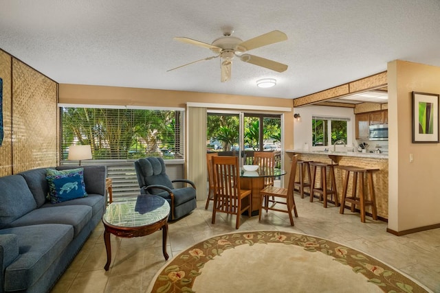 sunroom / solarium with ceiling fan