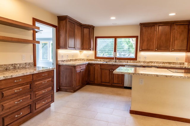 kitchen with sink and light stone countertops