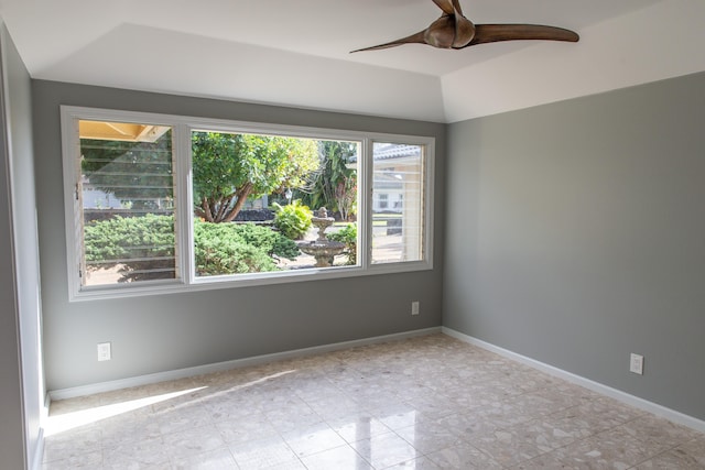 spare room with ceiling fan and lofted ceiling