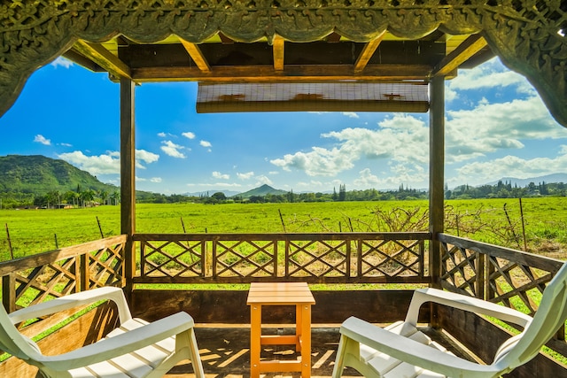 view of patio with a mountain view and a rural view