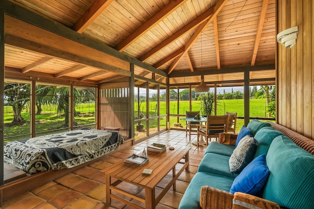 sunroom featuring wood ceiling and vaulted ceiling with beams