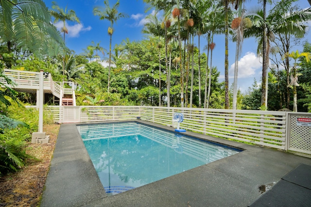 view of pool featuring a fenced in pool and a wooden deck