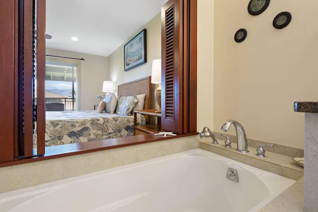 bathroom with a tub to relax in