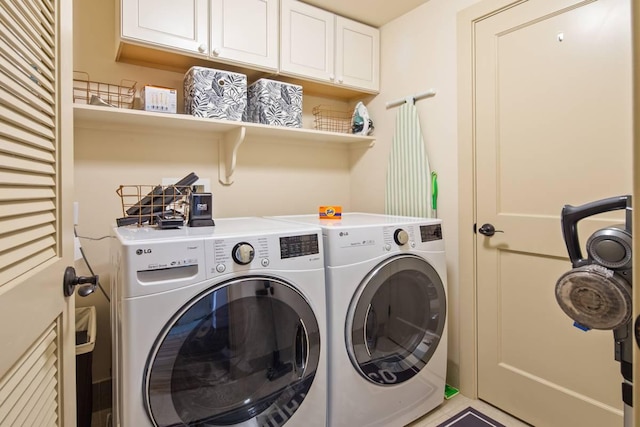 laundry room with cabinets and independent washer and dryer