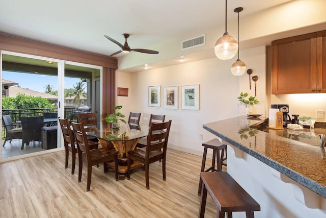 dining area featuring light hardwood / wood-style flooring and ceiling fan