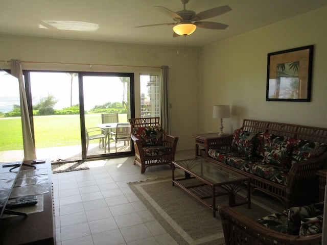 tiled living room with ceiling fan