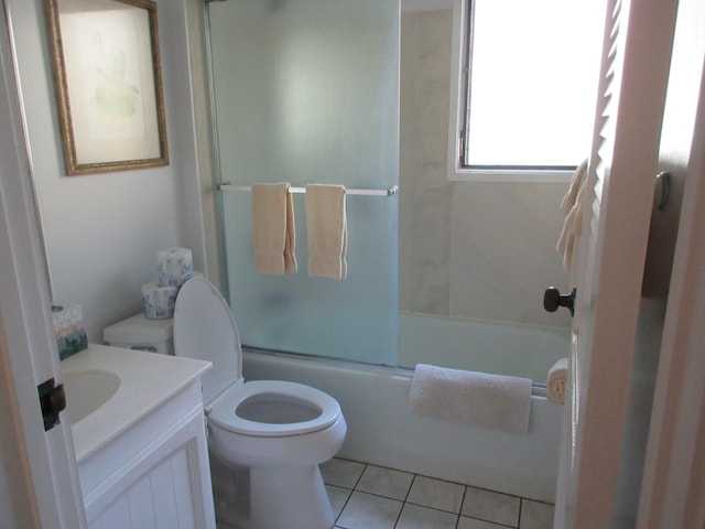 full bathroom featuring tile patterned flooring, vanity, enclosed tub / shower combo, and toilet