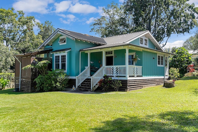 bungalow featuring a front yard and covered porch