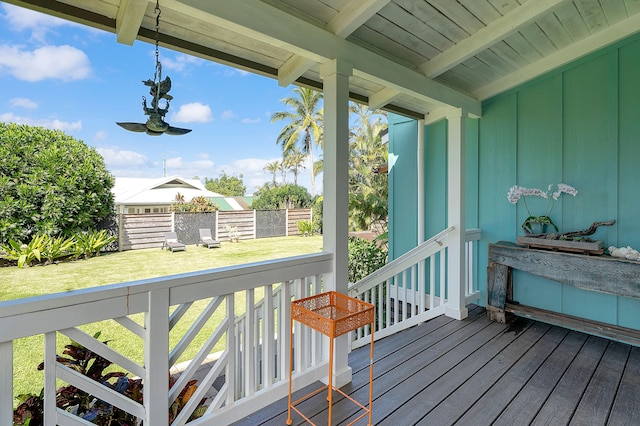 wooden terrace with a yard