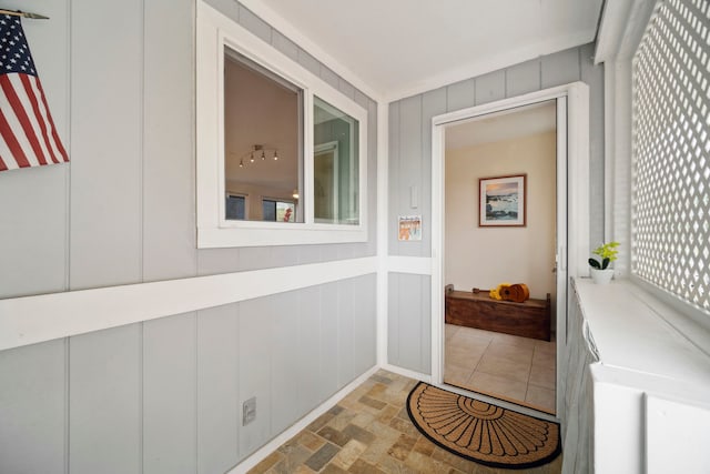 doorway to outside with a decorative wall