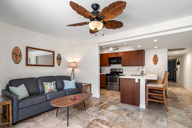 living room featuring visible vents, a ceiling fan, and recessed lighting