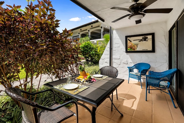 exterior space featuring outdoor dining area and a ceiling fan