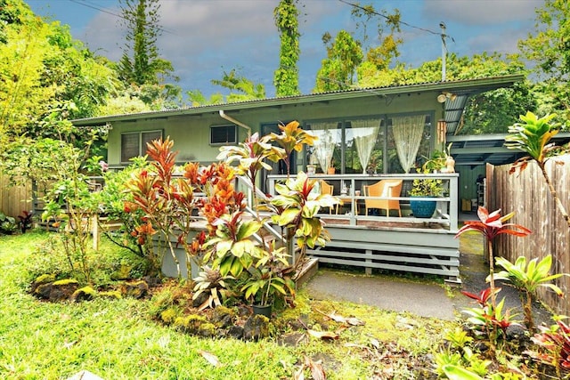 back of house with fence