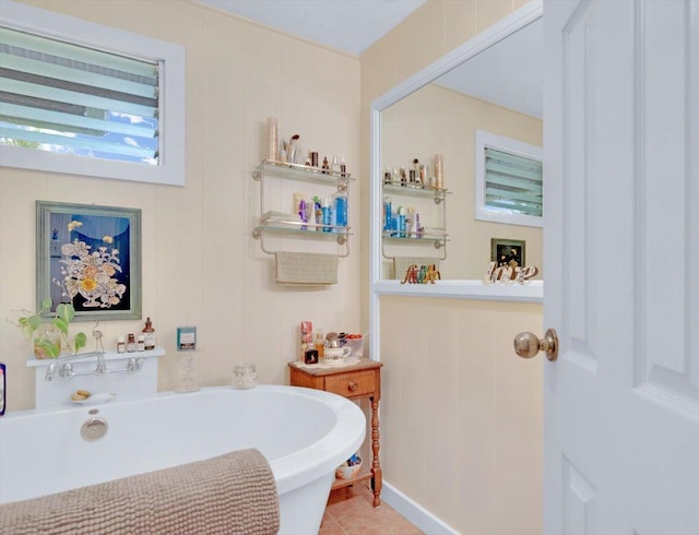 full bath featuring tile patterned flooring and a bath