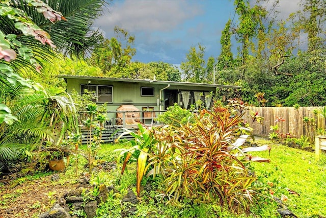 view of outbuilding with fence