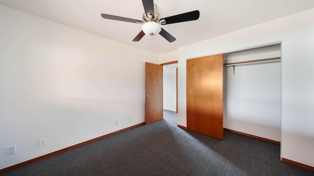 unfurnished bedroom with a closet, dark carpet, and ceiling fan