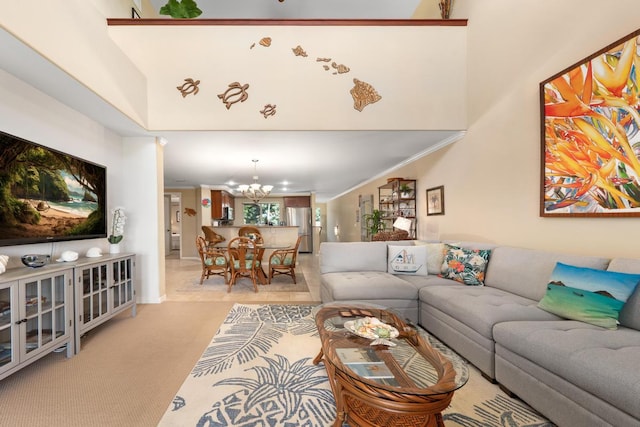 living room with carpet, crown molding, an inviting chandelier, and a towering ceiling