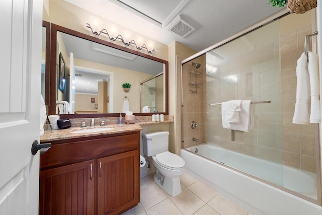 bathroom featuring visible vents, toilet, tile patterned floors, vanity, and enclosed tub / shower combo