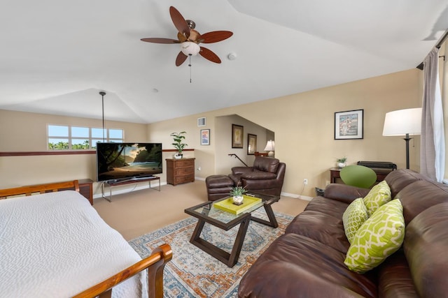 living room featuring visible vents, a ceiling fan, carpet, baseboards, and vaulted ceiling