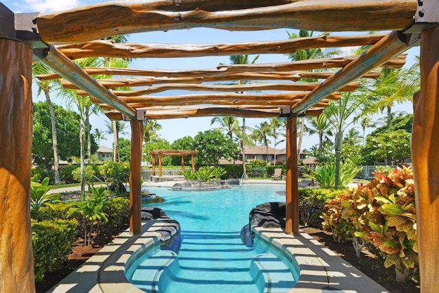 community pool featuring a pergola and a patio