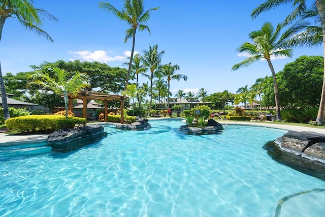 community pool featuring a pergola