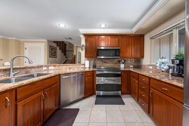 kitchen with tasteful backsplash, visible vents, light tile patterned flooring, stainless steel appliances, and a sink