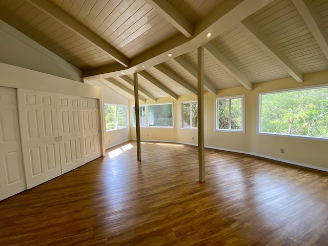 interior space featuring wood ceiling, dark hardwood / wood-style floors, and vaulted ceiling with beams