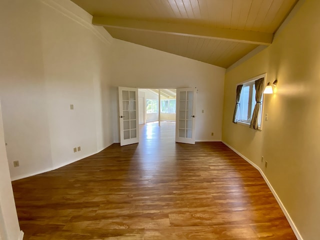 empty room featuring wood ceiling, vaulted ceiling with beams, hardwood / wood-style flooring, and french doors