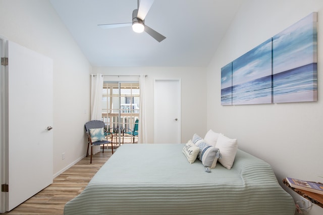 bedroom featuring access to exterior, light wood finished floors, a ceiling fan, vaulted ceiling, and baseboards