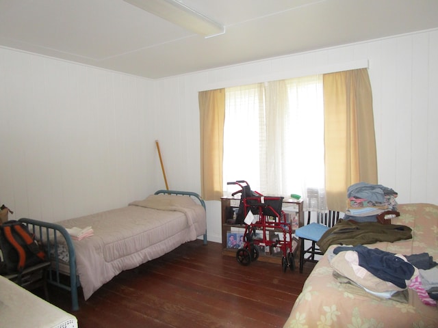 bedroom featuring dark wood-type flooring