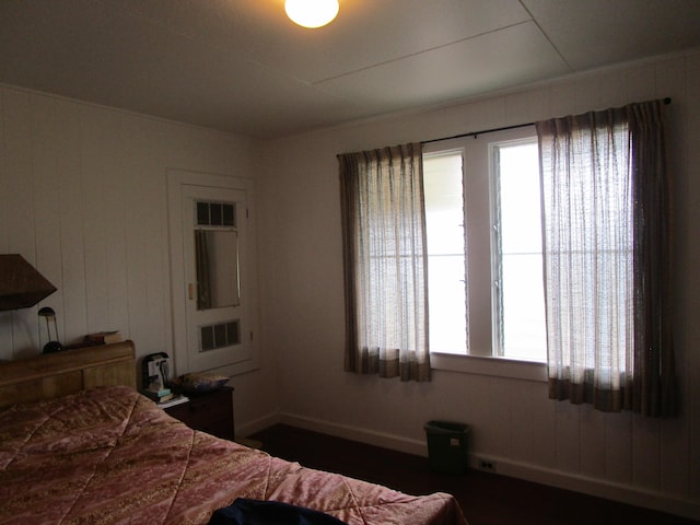 bedroom with multiple windows