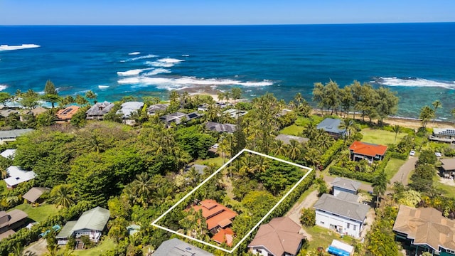 birds eye view of property with a water view and a residential view