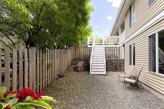 view of patio / terrace with stairs and a fenced backyard