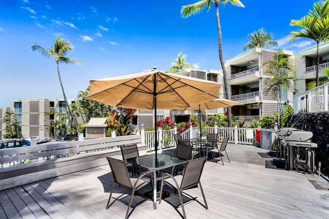 deck with outdoor dining area