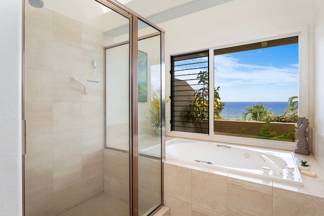 full bath featuring a water view, a shower stall, and a bath