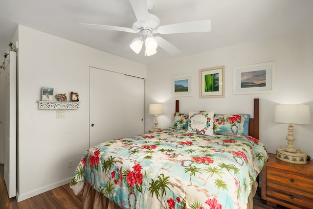 bedroom with a closet, ceiling fan, baseboards, and wood finished floors