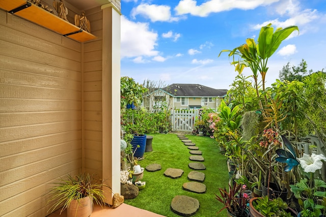 view of yard with a gate and fence