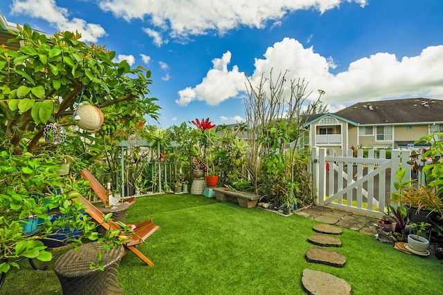 view of yard with a gate and fence