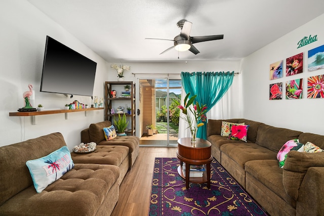 living room featuring wood finished floors and a ceiling fan