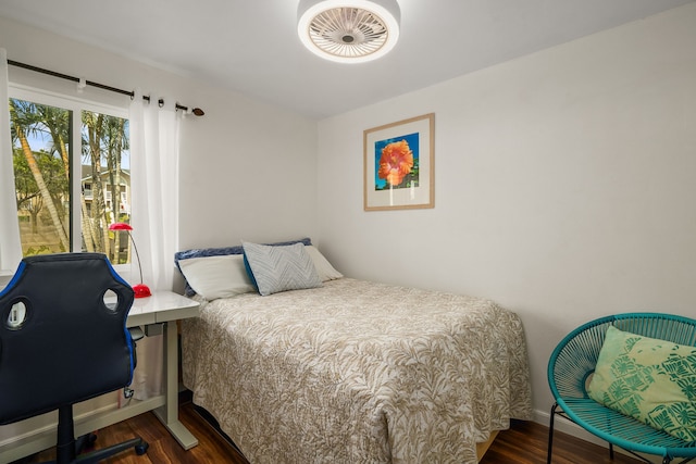 bedroom with wood finished floors